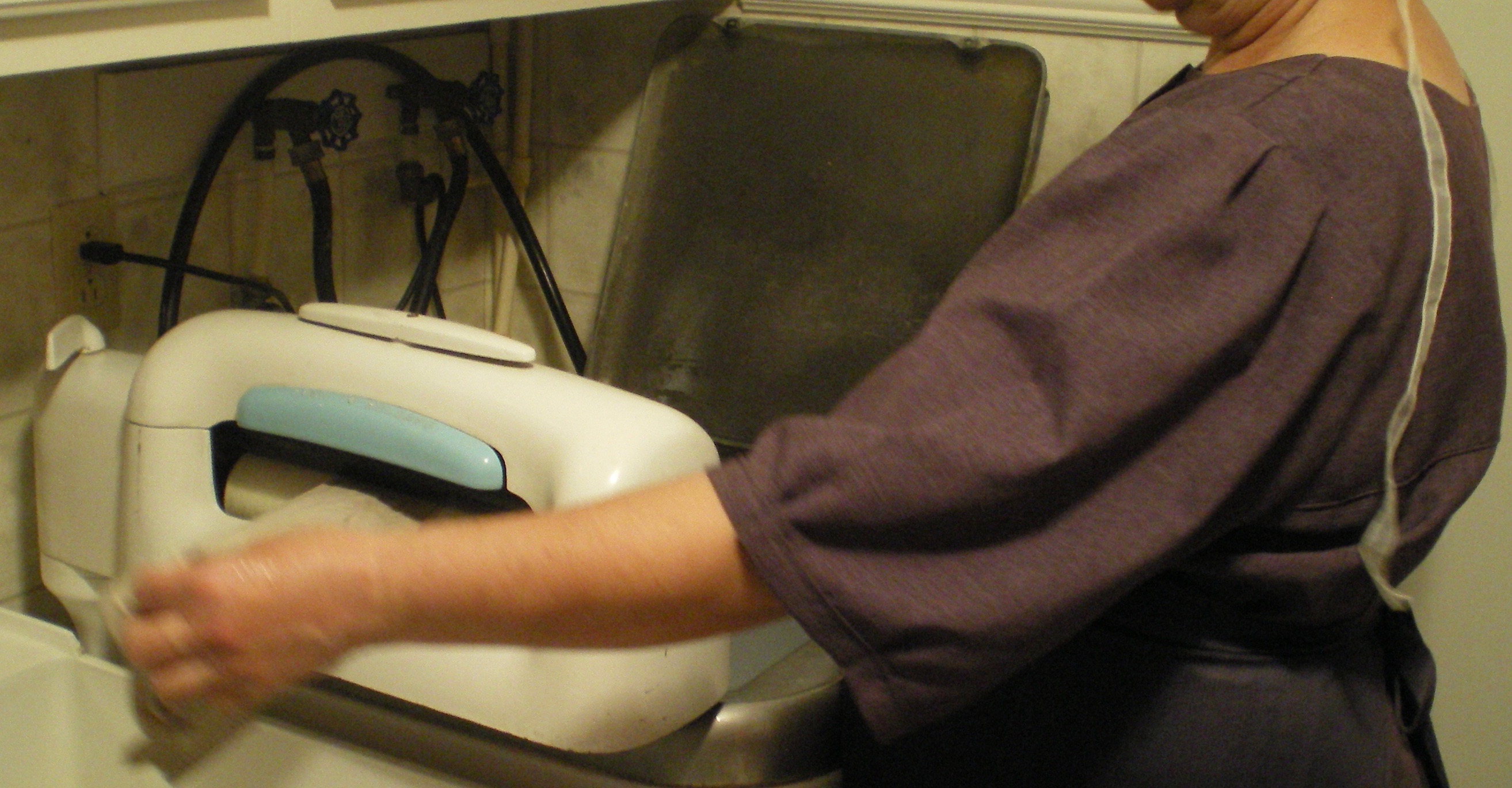 My Pennsylvania Amish friend showing me how she does laundry with her old-fashioned wringer washer. She bought a house from an Englischer, so she has electricity and just plugs the washer in!